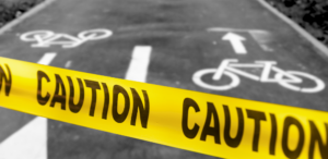 Bike trail with caution tape across it.