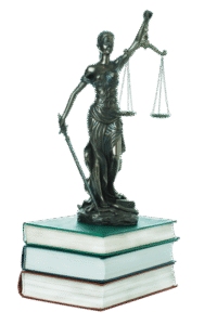 Lady justice statue standing on a pile of books